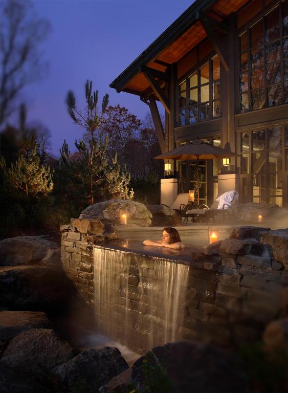 Romantic hot tub with woman looking out at the view
