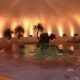 Hot tub with romantic lighting in background
