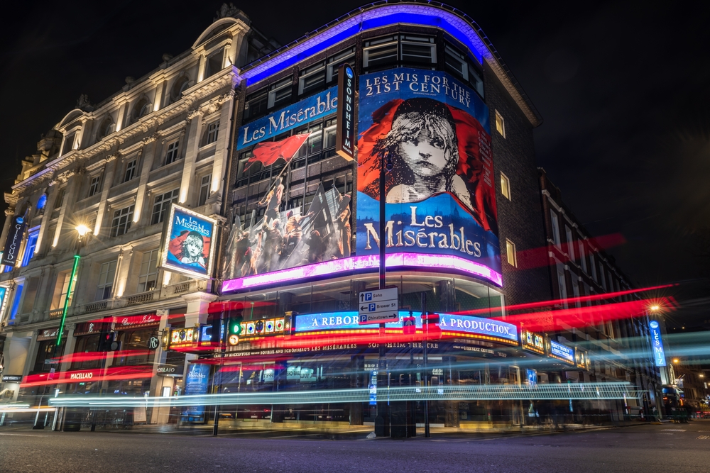  A night time street view of the Sondheim Theatre on Shaftesbury Avenue hosting the musical Les Miserables. One of the romatic things to do in London. 