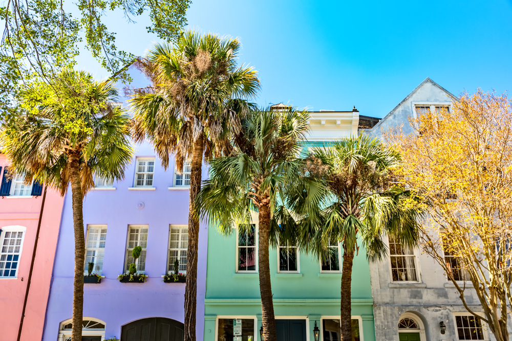 the pastel colored houses of Rainbow Row. The article is about tours in Charleston SC