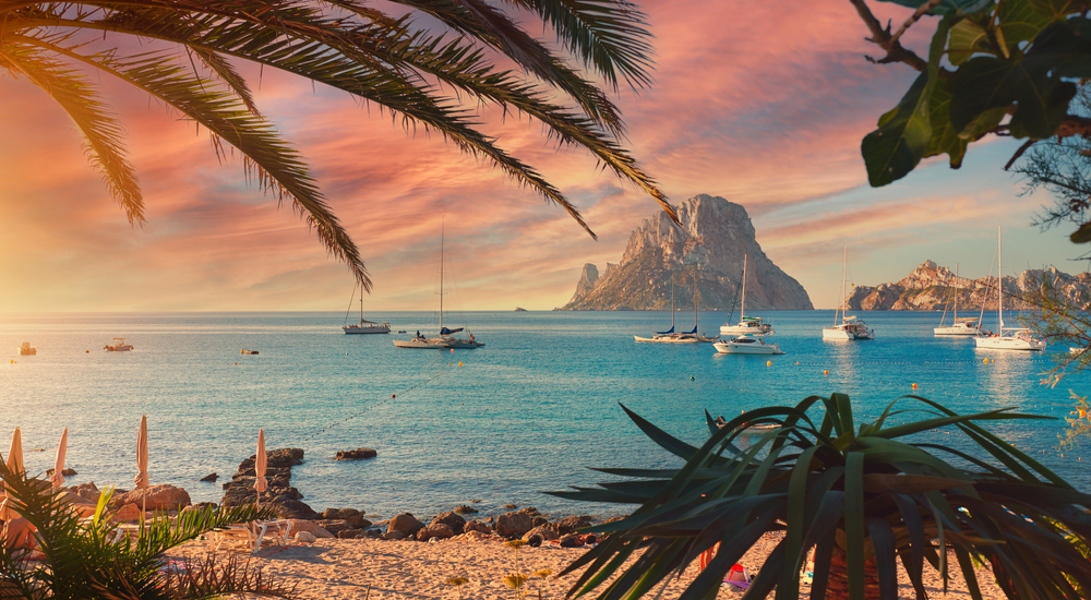 Cala d'Hort beach with a fantastic view of the mysterious island of Es Vedra. Ibiza Island, Balearic Islands. 