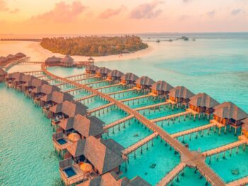 overwater bungalows surrounded by emerald green waters