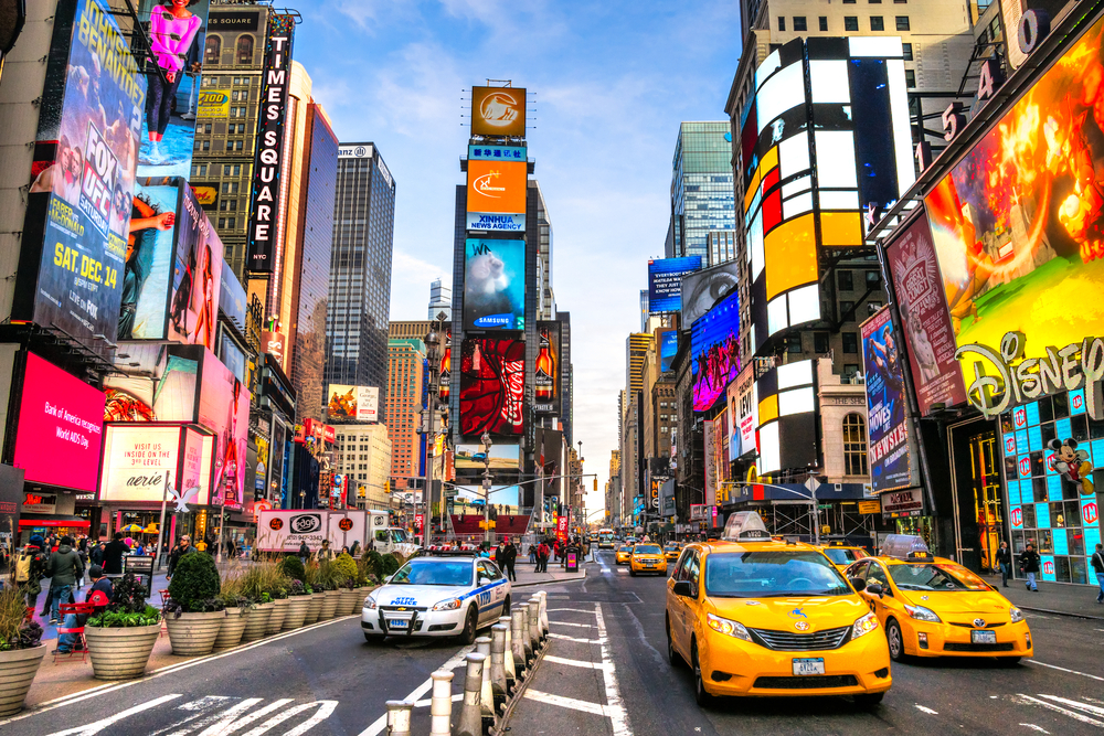 Times Square  is an iconic street of New York City and America. You can see all the lights and taxis on the street.  