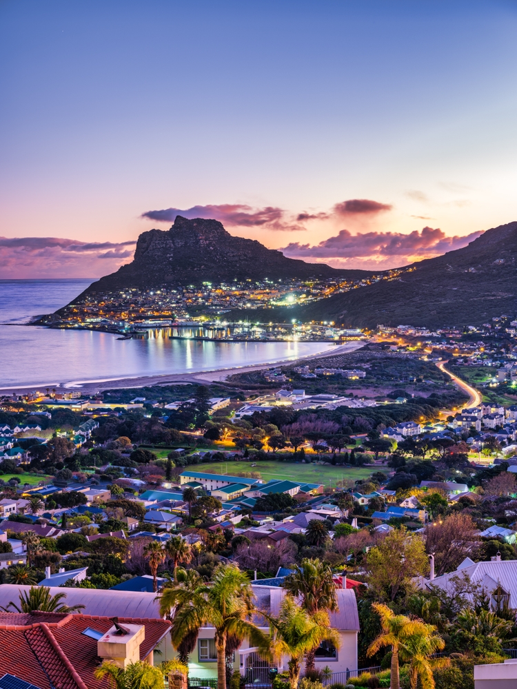 Shot of hout bay town, harbour and the fishermen town at dusk, Cape Town, South Africa. One of the 40th birthday vacation ideas