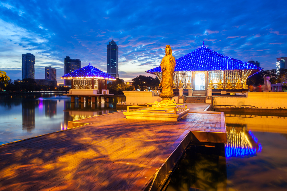 Seema Malaka buddhist temple in the Beira Lake in Colombo, Sri Lanka at sunset. Seema Malaka is a part of the Gangaramaya Temple.