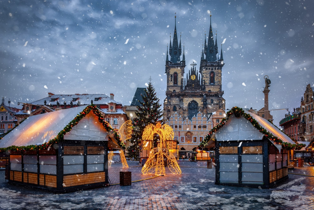 christmas lighting in a town where it is snowing