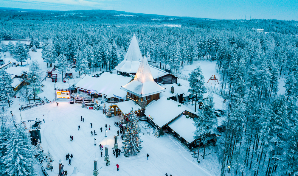 aerial view of snow covered town with christmas decorations christmas vacation ideas