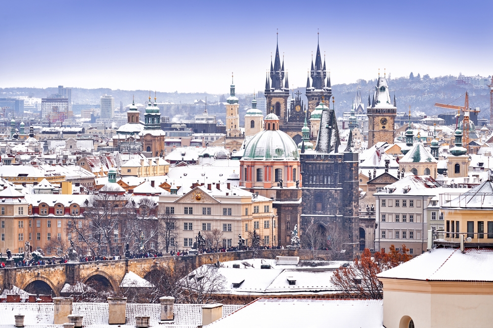  Prague Castle in Czech Republic, snowy weather with trees. City landscape from beautiful town. One of the places to visit in Europe in winter