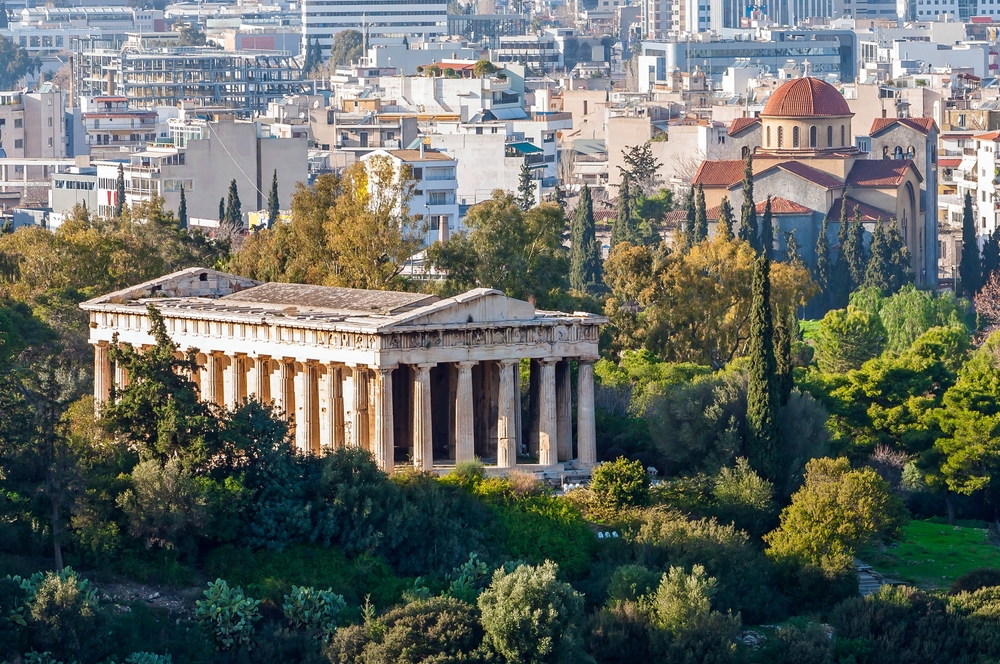 Doric Temple of Hephaestus (Hephaisteion) and Holy Trinity (Agia Triada) Church in Athens, Greece. The temple is located at the north-west side of the Agora.