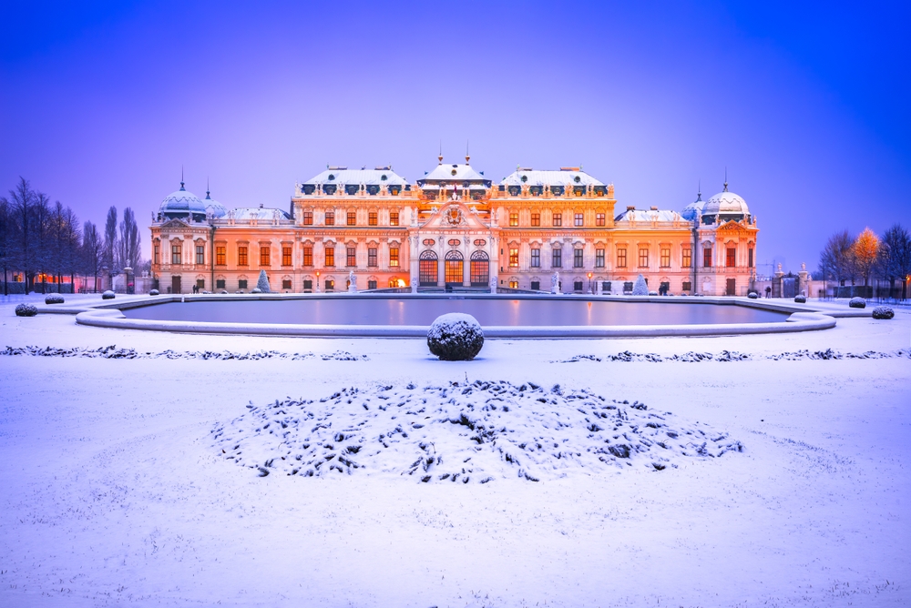 Wien's iconic Belvedere Palace, a masterpiece of baroque architecture, stands tall amidst a winter snowstorm.