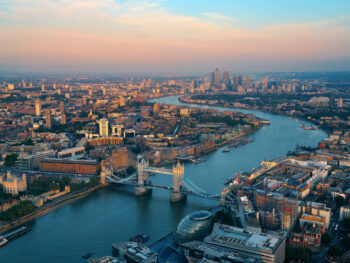 aerial view of a city with a bridge with two towers things to do near heathrow