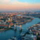 aerial view of a city with a bridge with two towers things to do near heathrow