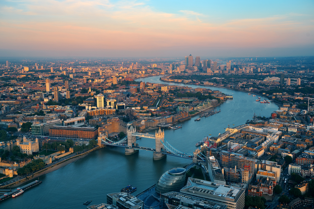 aerial view of a city with a bridge with two towers things to do near heathrow