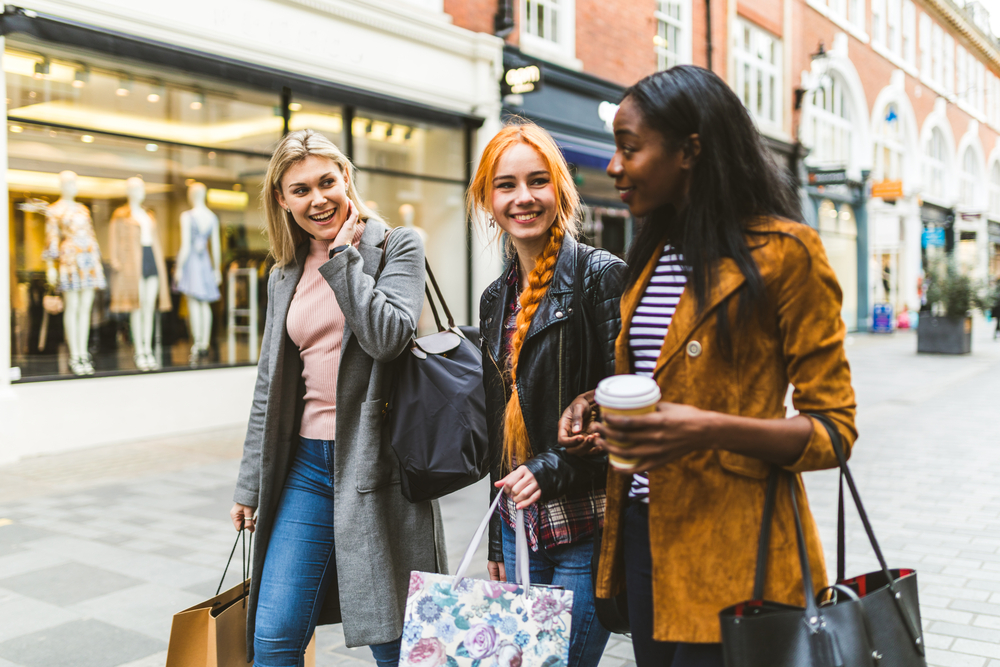 Three people walking in London in spring.  What to wear in London in spring