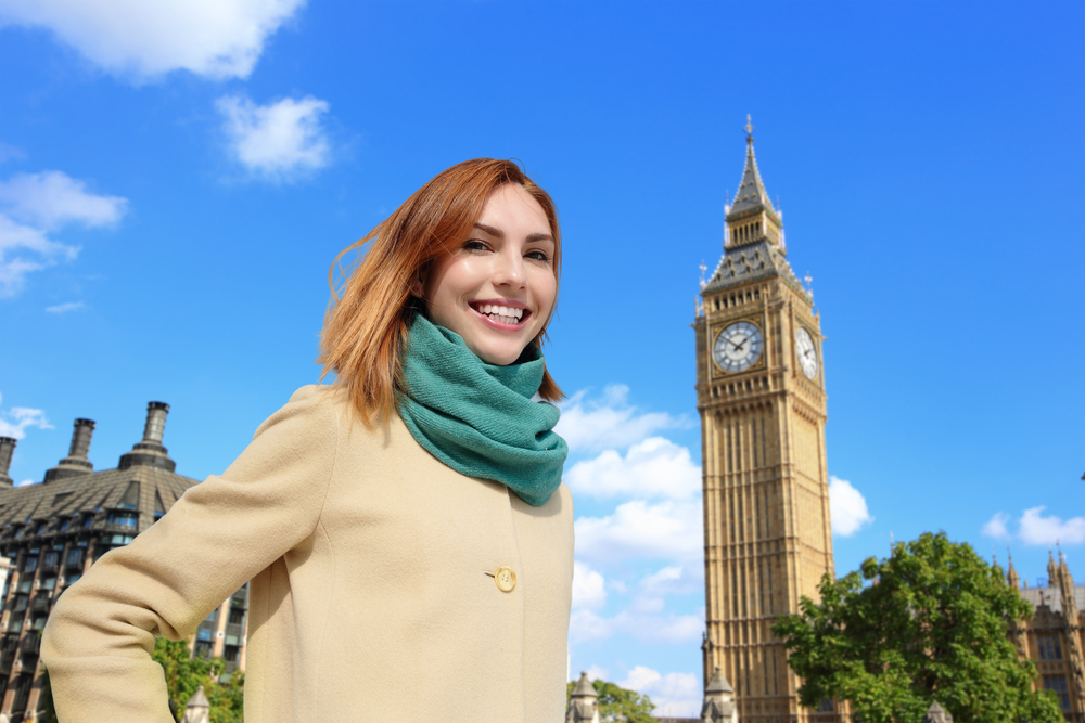 Women near Big Ben in spring weather. 