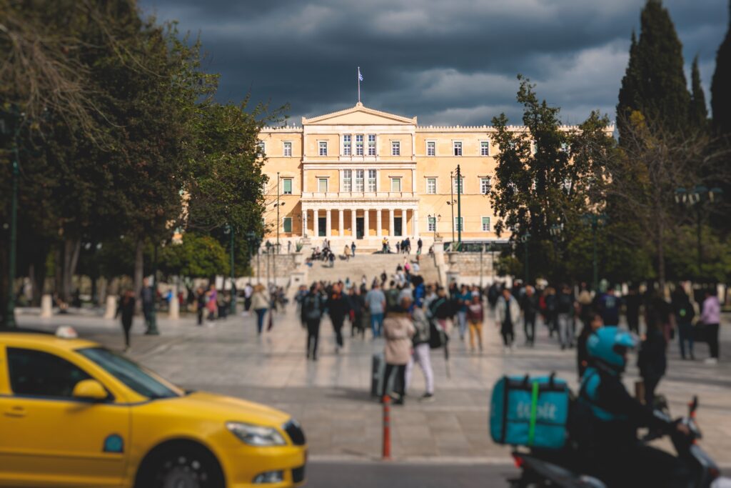 Greek Parliament in Old Royal Palace. Hellenic Bouleterion parliament house on Syntagma square, Athens, Attica, Greece in a summer day.