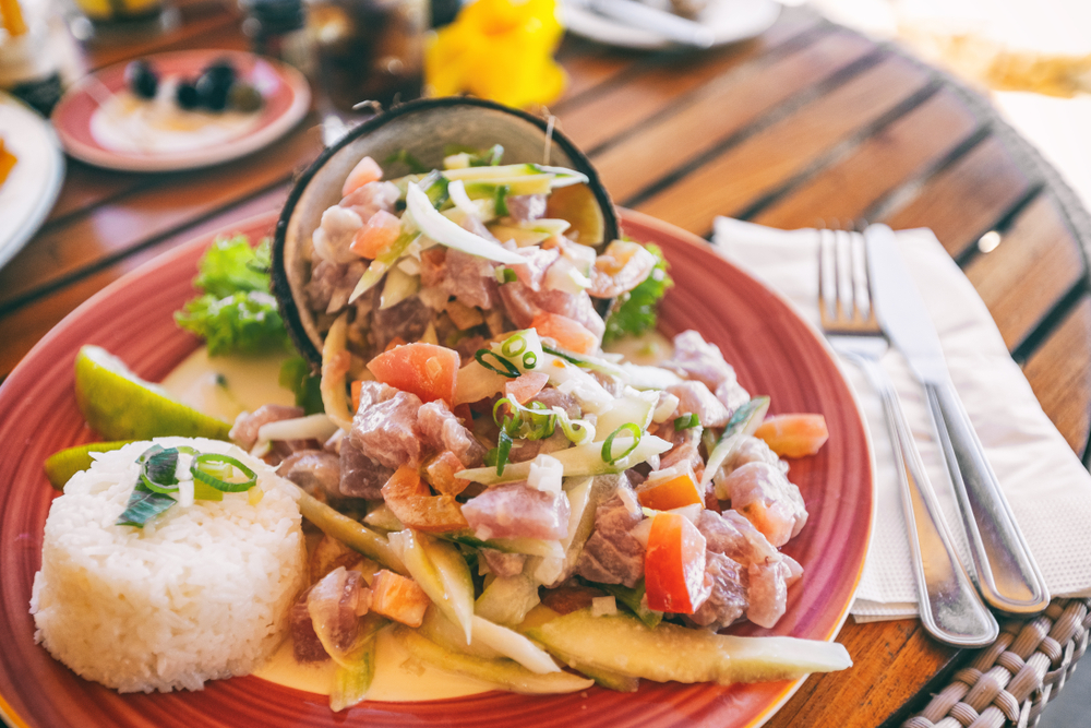 A plate of Poisson Cru, a dish with seafood and rice.