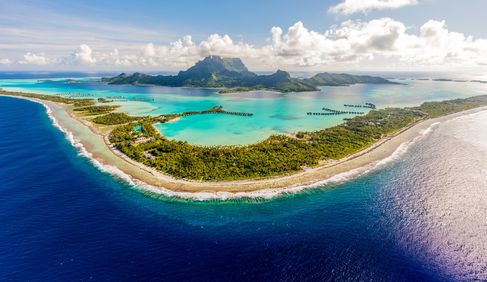 High aerial view of Bora Bora with long beaches and a beautiful lagoon.