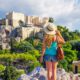 woman tourist looking at the acropolis ruins traveling to athens