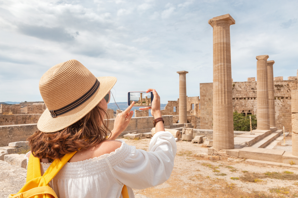 girl clicking photos of the historical building tours in athens