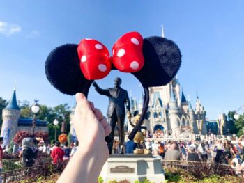 minnie mouse headband in front of the disney castle