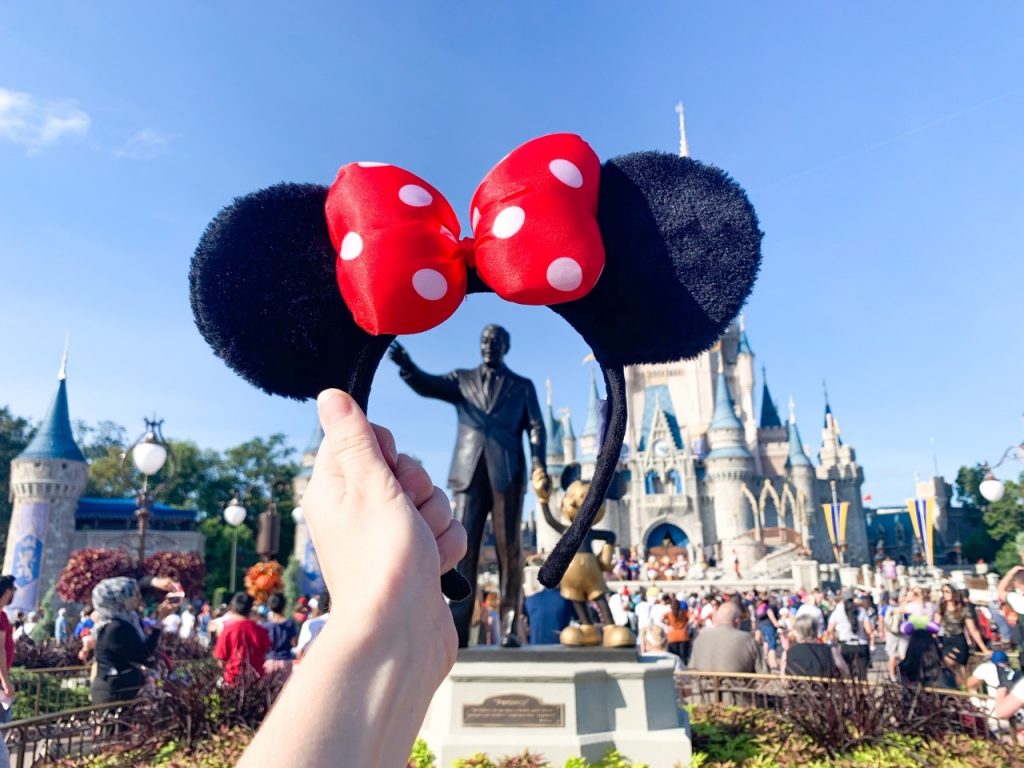 minnie mouse headband in front of the disney castle