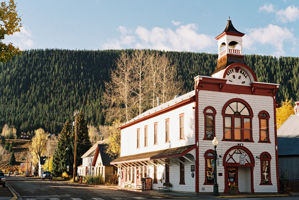 City Hall in Crested butte Colorado downtown with a scenic background. The article is about a Colorado road trip.