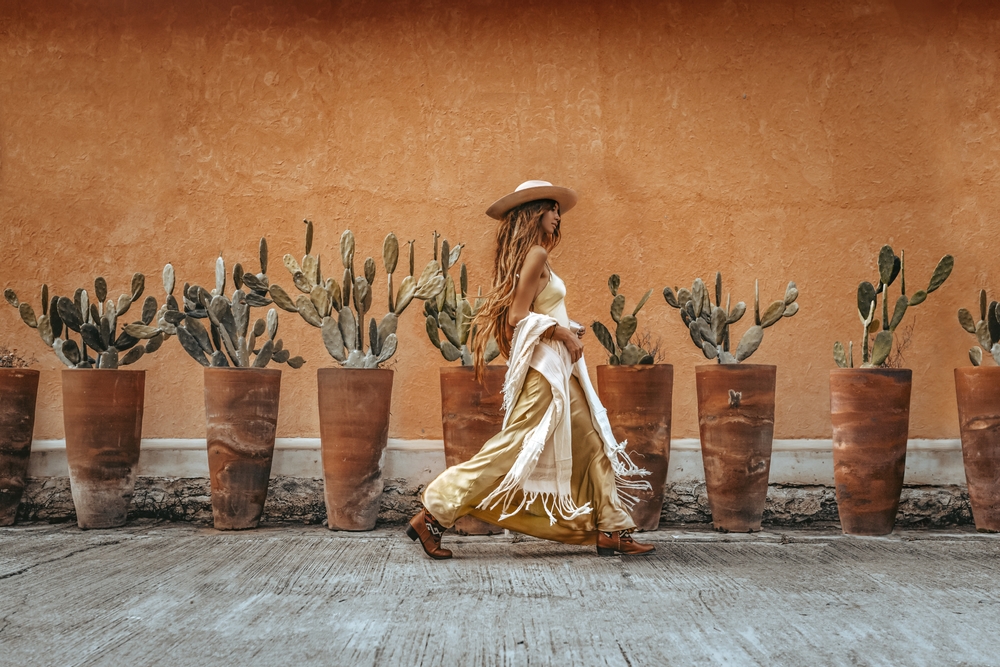 beautiful young woman in elegant dress outdoors.  article is about Austin outfits 
