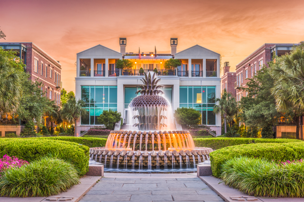 Waterfront Park Pineapple Fountain with houses in the background.