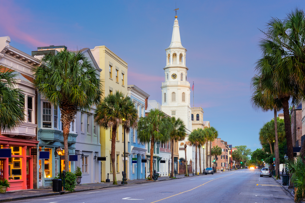 Cityscape in the historic district at twilight. you can see the roach with houses and a church.