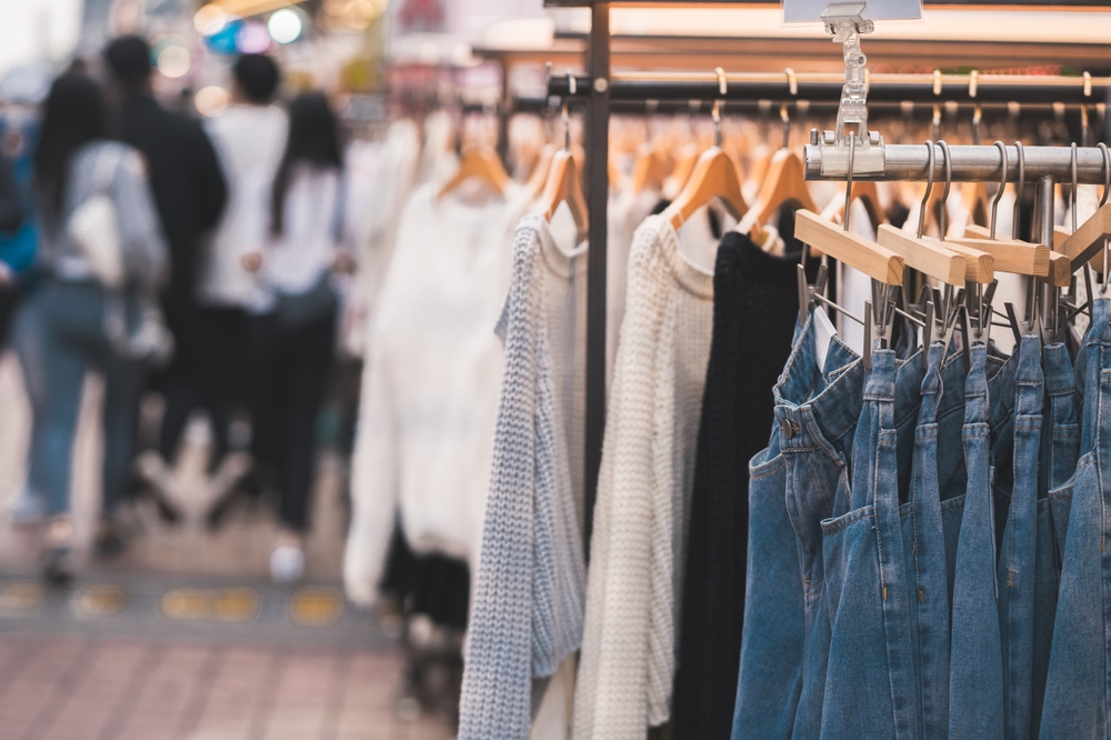 jeans and sweaters hanging from racks things to do in seoul