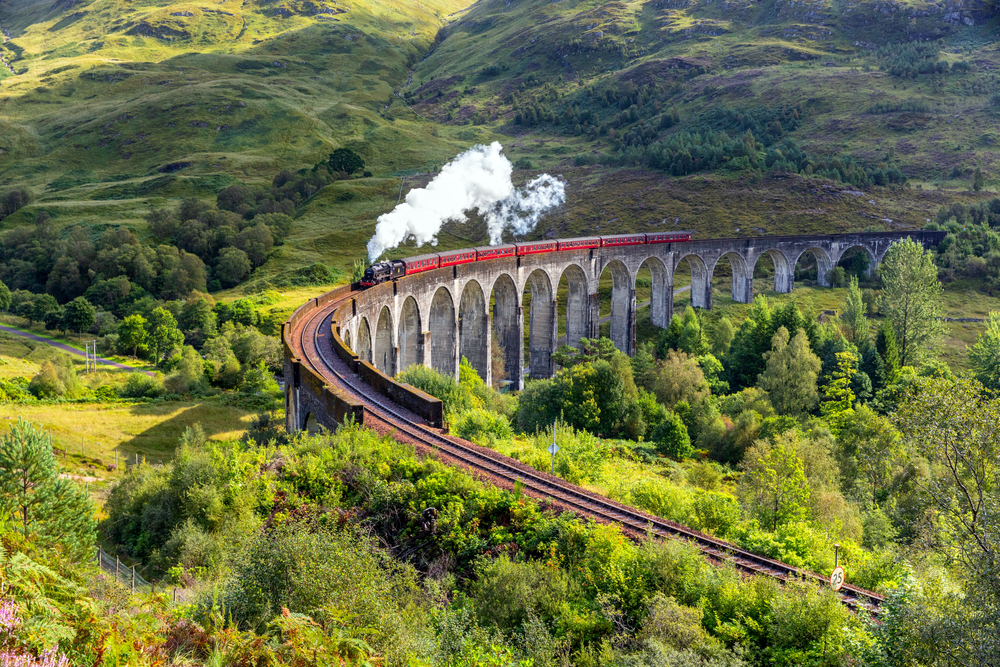 steam engine train on a bridge european train trips