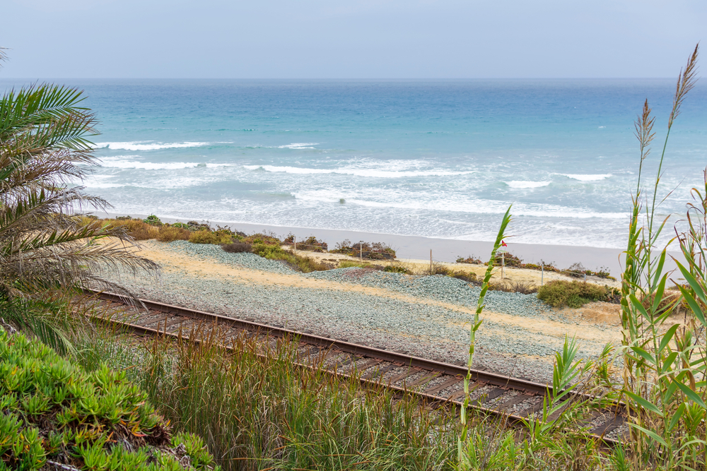 A view of Pacific ocean from San Diego beach with rail track, southern California