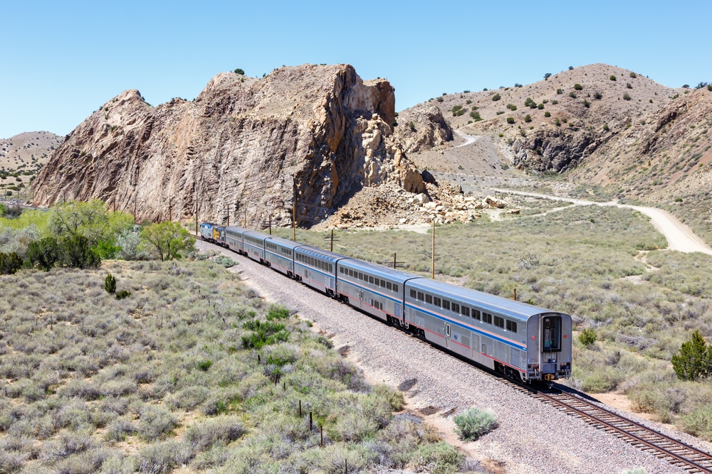 Amtrak Southwest Chief passenger train railway in Los Cerrillos New Mexico, United States. Article is about train trip in the USA