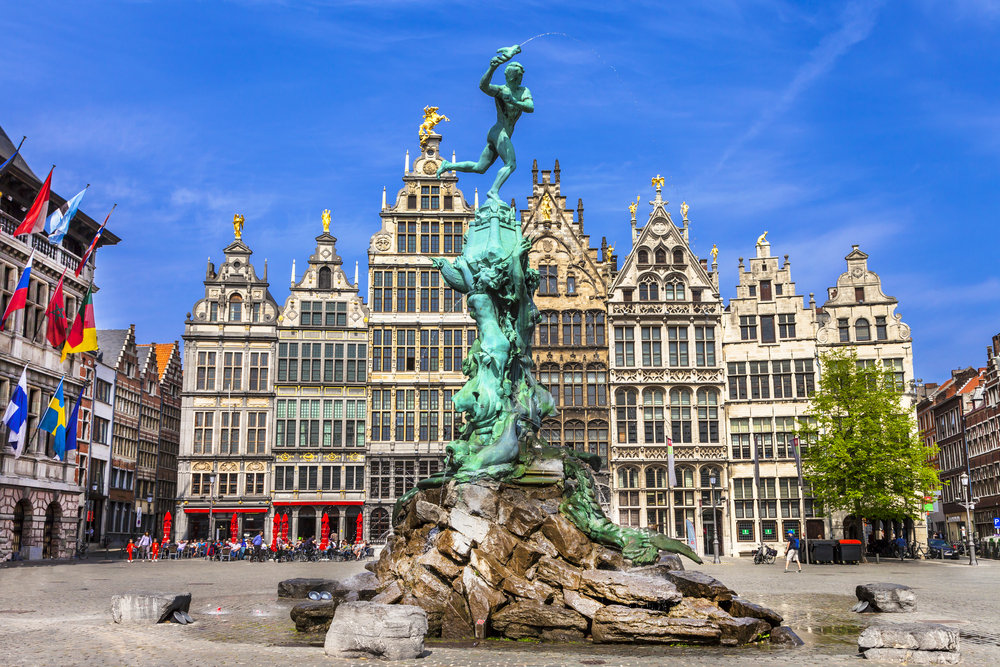 statue in front of flemish architectural buildings cities in belgium