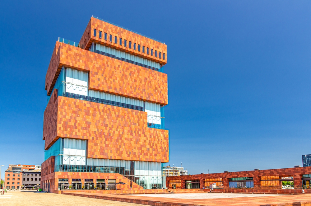 orange red brick building with huge windows