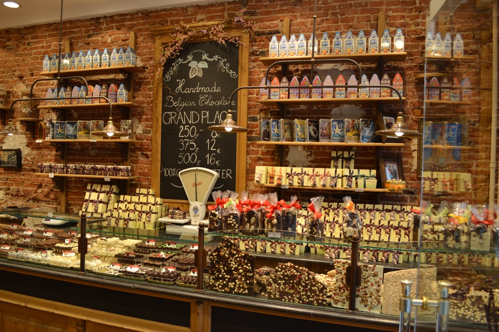 Beautiful chocolate store in Brussels, Belgium. It shows the counter with all the chocolate behind the glass. 