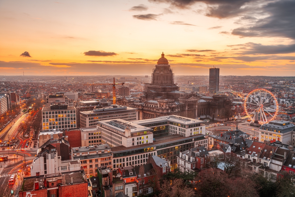 Brussels, Belgium cityscape at Palais de Justice during dusk. The article is about  traveling to Brussels. 