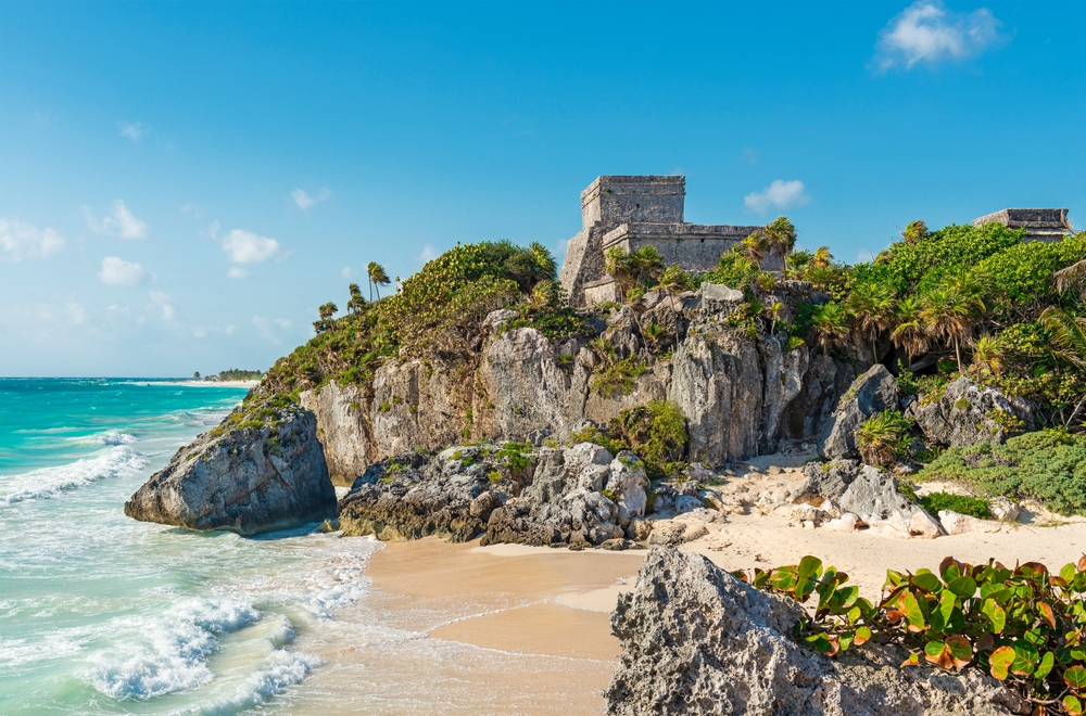 beach with ruins and rocks cancun travel tips